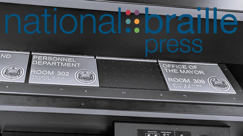 The logo of National Braille Press on a black and white photo of an industrial printer creating ADA signs reading Personnel Office and Office of the Mayor in print and braille.